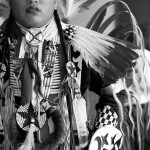 Young aboriginal man dressed in traditional dress for powwow