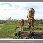 Toy figurine of Indian Couple in foreground, green park, grass covered lawns and urban cityscape with skyscrapers in background